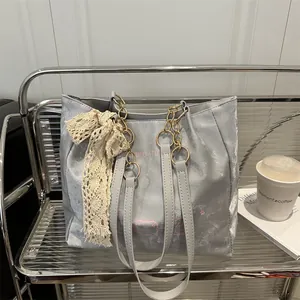 Silver metallic tote bag with lace bow, chain strap and cute printed design
