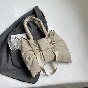 Quilted bow tote bag in beige nylon fabric, versatile shoulder and crossbody design