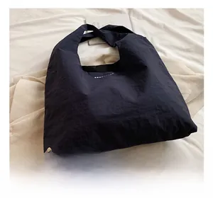 Minimalist large-capacity nylon tote bag with pleated texture and stylish shoulder strap