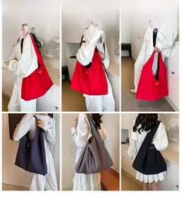 Multi-color nylon tote bags shown on model featuring red, blue, grey, and black options