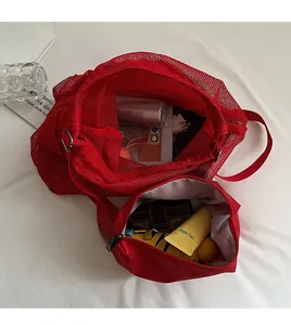 Detail view of large red mesh drawstring bag interior showing high storage capacity
