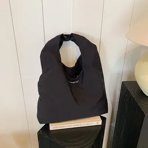 Minimalist black large capacity nylon tote bag with shoulder straps for women
