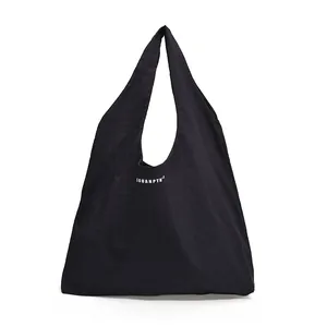 Minimalist large capacity black nylon tote bag with SOUANPTH logo and wide shoulder straps