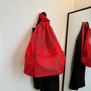 Breathable red mesh drawstring backpack with front zipper pocket for gym and sports