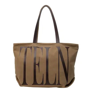 Grand sac cabas en toile kaki avec poignées en cuir marron et imprimé TELN élégant