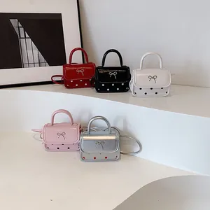 Mini glossy leather crossbody bags with metal bow and polka dots in five colors