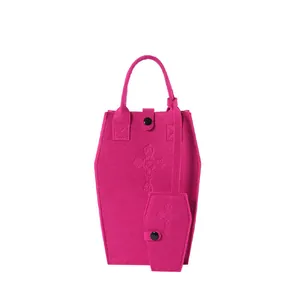 Unique rose red coffin-shaped felt handbag with embossed cross and mini accessory bag