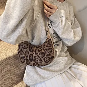 Leopard print crescent hobo bag for women with gold hardware and stylish retro pattern