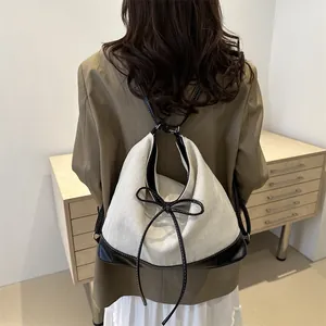 Large capacity canvas tote bag with contrast leather trim and chic bow detail