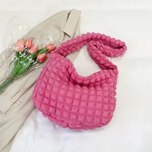 Detailed view of pink bubble texture tote bag with soft pleated fabric and large capacity