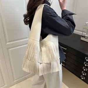 White pebbled leather shoulder bag with fringe tassel detail, large capacity fashion tote