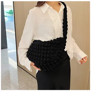 Minimalist black puff shoulder bag with 3D texture and crescent shape for women