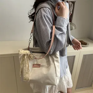 Women's cream tote bag with pink straps and lace bow, casual shoulder bag for commuting