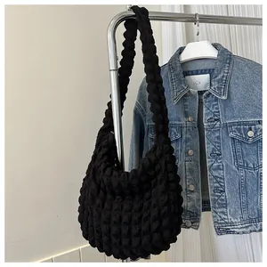 Soft black puff shoulder bag with popcorn texture and large capacity for daily commuting