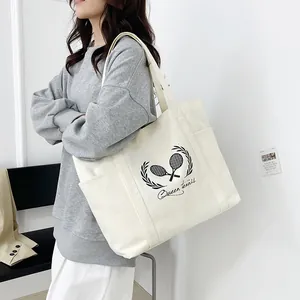 Large capacity off-white canvas tote bag with Queen Tennis print and side pockets