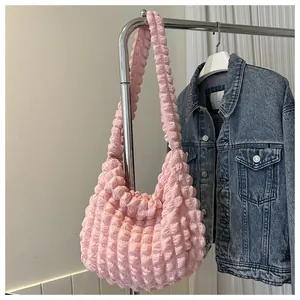 Pink popcorn textured hobo shoulder bag with soft cloud-like pleated fabric material