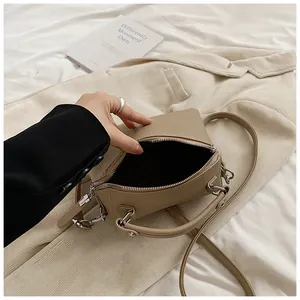 Top view of khaki Boston bag showing wide zipper opening and dark fabric lining