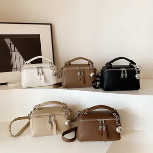 Elegant multi-color Boston handbags with lychee texture and silver ball charms on stairs