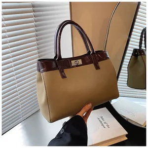 Two-tone khaki and brown tote bag with metal twist lock for professional commuting