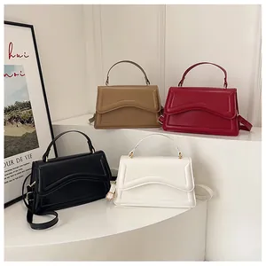 Collection of minimalist leather crossbody bags in khaki, red, black and white colors