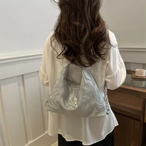 Silver tote bag with liquid water ripples and butterfly metal buckle for women