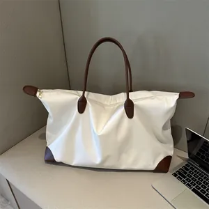 Weiße Nylon-Tragetasche mit braunen Ledergriffen und Laptop für große Kapazität