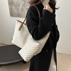 Large capacity vintage pattern tote bag with matching pouch shown on a fashion model