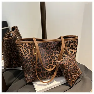 Leopard print tote bag set with matching small pouch and brown leather handles