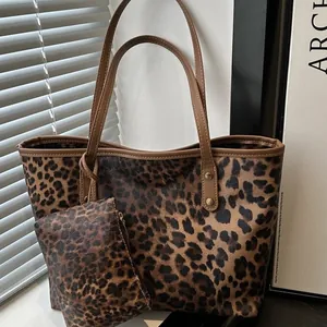 Leopard print tote bag set with matching small zipper pouch and brown handles