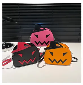 Detailed view of three creative Halloween pumpkin crossbody bags in pink, black, and orange