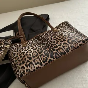 Leopard print tote bag set with matching pouch and brown leather handles for women