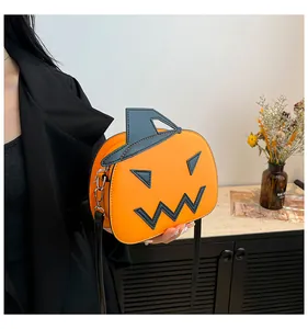 Detail of pumpkin crossbody bag with black wizard hat and silver metal buckles