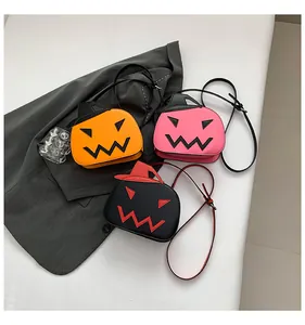 Three pumpkin crossbody bags in orange, pink and black with wizard hat detail