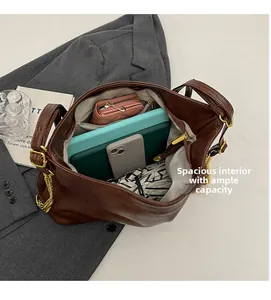 Detailed interior of brown crocodile pattern tote bag showing large capacity space