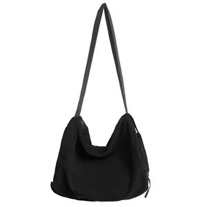Sac à bandoulière minimaliste en nylon noir pour étudiants avec une grande capacité