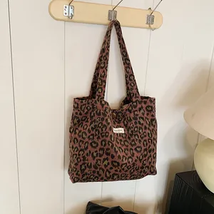 Stylish leopard print tote bag in soft wool fabric with vintage wooden button closure