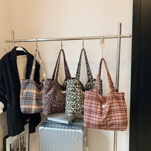 Retro plaid and leopard print large capacity woolen tote bags for women on display