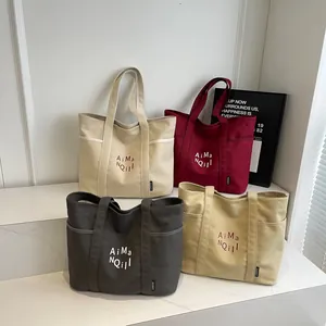 Borse tote minimaliste in tela in quattro colori con ricamo per il pendolarismo