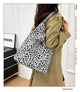 Fashionable leopard print canvas tote bag styled with a khaki trench coat for daily look