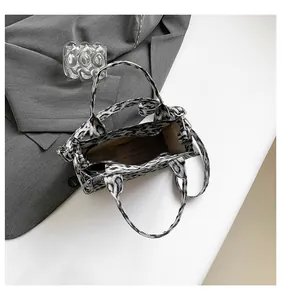 Top view of animal print crossbody bag interior compartment with zipper and detachable strap