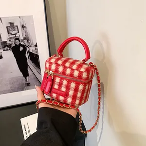 Red and white plaid tweed mini bucket bag with chain strap and top leather handle