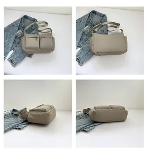 Détails d'un sac bandoulière en nylon kaki avec plusieurs poches et sangle réglable