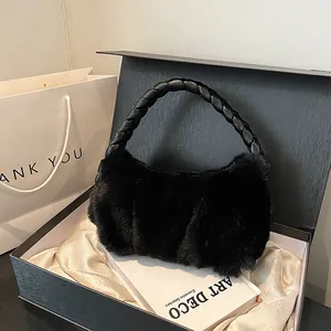 Furry black faux fur handbag with braided handle displayed in premium gift box set