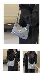 Dettagli della borsa hobo in tela azzurra con applicazioni di farfalle 3D colorate