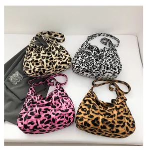 Top view of woven leopard print hobo bags in four colors with adjustable straps