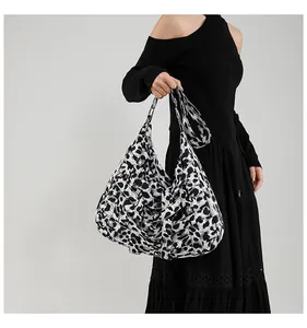 Detail shot of vintage leopard print woven tote bag with matching wide shoulder strap