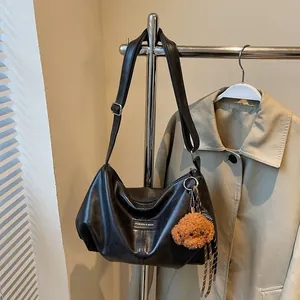 Fashionable black large capacity tote bag with adjustable strap and cute dog pendant