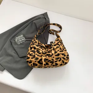 Chic leopard print tote bag with woven fabric and stylish pleated shoulder strap detail