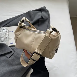 Minimalist cream white underarm bag with adjustable wide strap and silver buckle detail