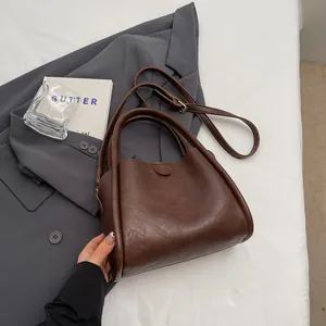 Retro dark brown large capacity crossbody bag with adjustable strap and top handle